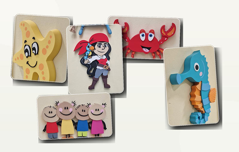 Individuelle 3D Logofiguren für die Kita Nassau Lah als farbige Wandlogos mit Seestern, Piratin, Krabbe, Seepferdchen und Kinderfiguren